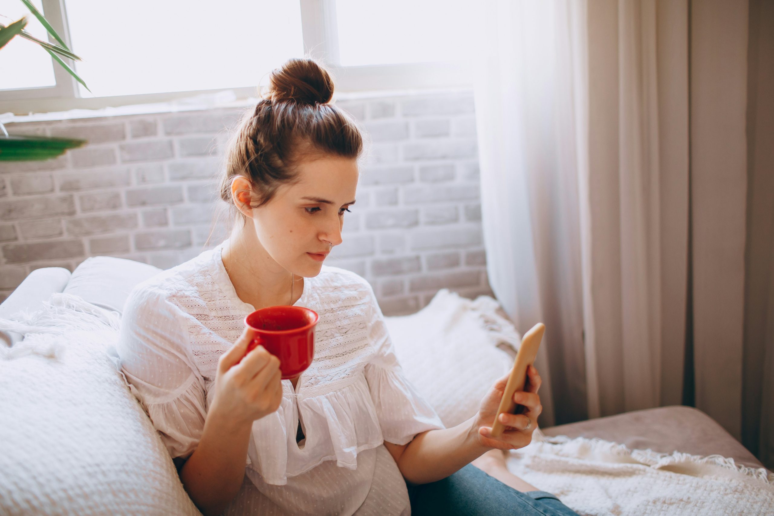 Patient checking a payment reminder on her phone