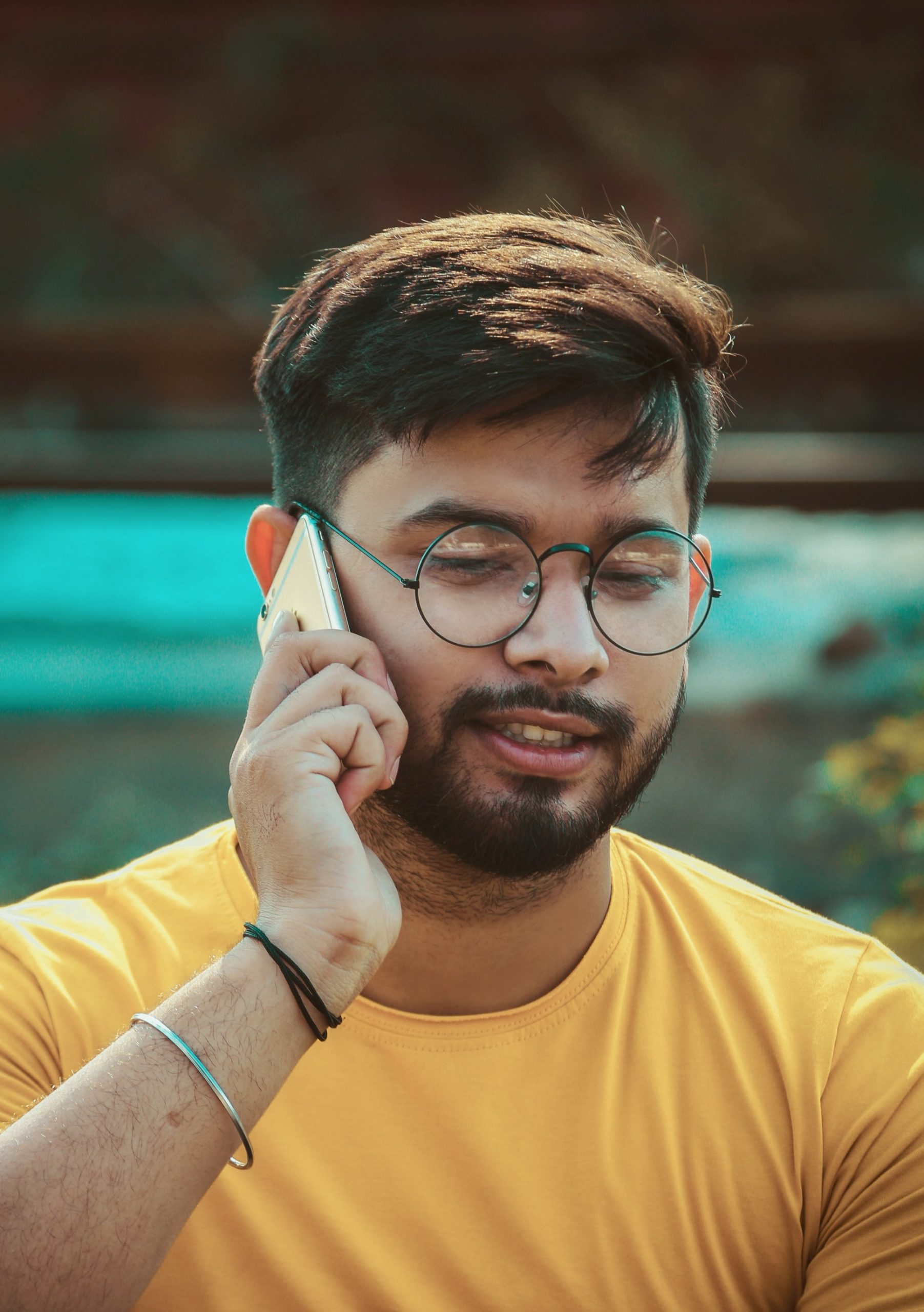A patient handling a billing call on his phone
