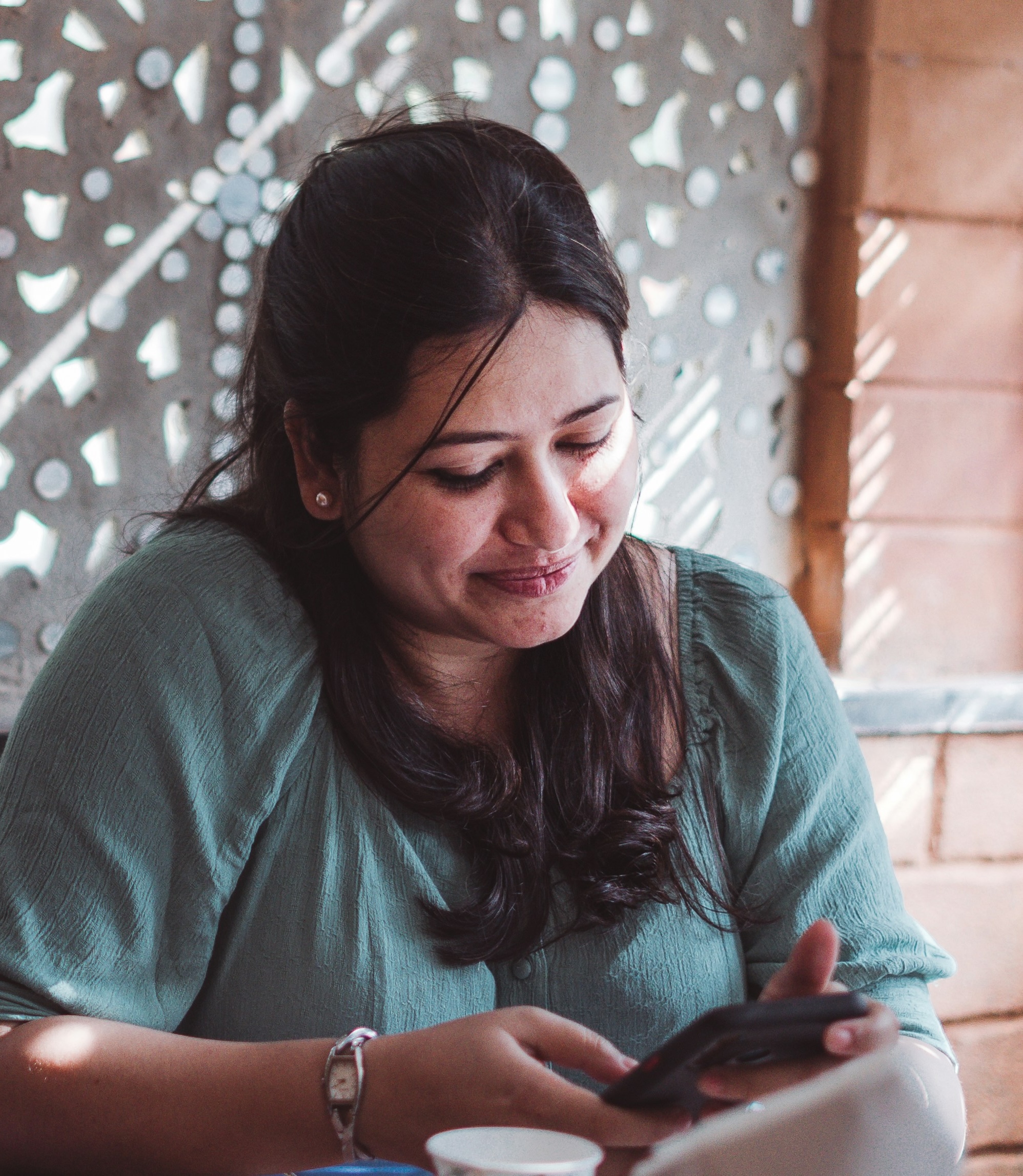 A patient reading a billing message on their phone